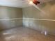 Bedroom with tile floors, ceiling fan, neutral walls, and ample space at 1809 Elm Ridge Ct, Orlando, FL 32808