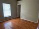 Bedroom with tile floors, bright window, and neutral paint at 1809 Elm Ridge Ct, Orlando, FL 32808