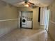 Laundry room featuring a washer, dryer, and tile floors at 1809 Elm Ridge Ct, Orlando, FL 32808