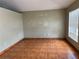 Spacious living room featuring tile floors and natural light from the window at 1809 Elm Ridge Ct, Orlando, FL 32808