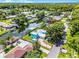 Waterfront property with lush landscaping, boat dock, and a charming, colorful exterior at 1811 Missouri Ave, Sanford, FL 32771