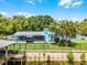 Beautiful backyard featuring a metal fence, gazebo, and waterfront access with a dock at 1811 Missouri Ave, Sanford, FL 32771