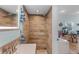 Bathroom shower with wood-like tile and a rain shower head at 1811 Missouri Ave, Sanford, FL 32771