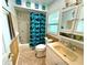 Charming bathroom with light blue accents, updated fixtures, and a shower-tub combo at 1811 Missouri Ave, Sanford, FL 32771