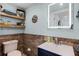 Charming bathroom with nautical themed decor and stylish vanity with a navy blue base at 1811 Missouri Ave, Sanford, FL 32771
