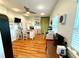 Bright dining area with wood floors, island, and modern appliances for a welcoming space at 1811 Missouri Ave, Sanford, FL 32771