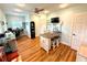 Versatile dining area with wood floors, island, and ample natural light for a functional space at 1811 Missouri Ave, Sanford, FL 32771