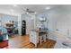 Bright dining area with hardwood floors, a ceiling fan, and a bar with seating at 1811 Missouri Ave, Sanford, FL 32771