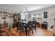 Bright dining room with a modern light fixture and rich wooden flooring at 1811 Missouri Ave, Sanford, FL 32771