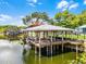 Boat dock featuring a covered structure with a metal roof and wooden support beams at 1811 Missouri Ave, Sanford, FL 32771