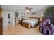 Spacious main bedroom with wood floors, ample storage and a massage chair at 1811 Missouri Ave, Sanford, FL 32771