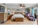 This main bedroom has wood floors, ample storage, and comfortable seating at 1811 Missouri Ave, Sanford, FL 32771