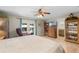 A main bedroom showcases a private patio, wood floors, and comfortable sitting area at 1811 Missouri Ave, Sanford, FL 32771