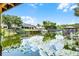 Beautiful view of homes along the water with docks and boat lifts in a peaceful setting at 1811 Missouri Ave, Sanford, FL 32771
