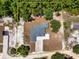 Aerial view of a single-story home on a large lot; surrounded by mature trees with property lines marked in yellow at 1845 Springhead Dr, Deltona, FL 32725