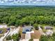 Aerial view of the home showcasing its location within a wooded area at 1845 Springhead Dr, Deltona, FL 32725