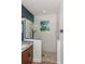 Modern bathroom with pebble-floored shower, granite counters and dark fixtures; inviting and clean at 1845 Springhead Dr, Deltona, FL 32725