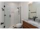 Bathroom features granite countertop, wood cabinets, and walk-in glass shower at 1845 Springhead Dr, Deltona, FL 32725