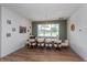 Elegant dining room with a large window, stylish furnishings, and warm, inviting decor at 1845 Springhead Dr, Deltona, FL 32725