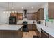 Spacious kitchen featuring white countertops, stainless steel appliances, and modern cabinetry at 1845 Springhead Dr, Deltona, FL 32725