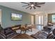 Relaxing living room with a large television, stylish decor, and ample seating at 1845 Springhead Dr, Deltona, FL 32725
