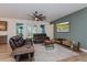 Comfortable living room featuring a ceiling fan, modern furniture, and a relaxing atmosphere at 1845 Springhead Dr, Deltona, FL 32725