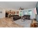 Open-concept living room connected to a kitchen, creating a seamless and inviting space at 1845 Springhead Dr, Deltona, FL 32725