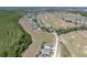 An aerial view captures a community, a golf course, and a stretch of woodland at 204 Birkdale St, Davenport, FL 33897