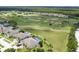 Beautiful aerial view of golf course community, showcasing lush greenery and neighborhood at 204 Birkdale St, Davenport, FL 33897