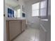 Bright bathroom with tile floors and a modern vanity at 204 Birkdale St, Davenport, FL 33897