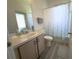 Bathroom featuring a shower curtain at 204 Birkdale St, Davenport, FL 33897