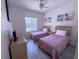 Bedroom featuring two twin beds and natural light at 204 Birkdale St, Davenport, FL 33897