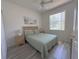 Bedroom with natural light, ceiling fan and coastal decor at 204 Birkdale St, Davenport, FL 33897