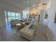 A spacious living room features light wood floors, recessed lighting, and comfortable couches for relaxation at 204 Birkdale St, Davenport, FL 33897
