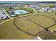 Community aerial view featuring a pool, dog park, and well-maintained landscaping in a desirable neighborhood at 2056 Airedale Way, Lake Alfred, FL 33850