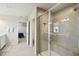 Elegant bathroom with a glass-enclosed shower featuring a built-in bench and tiled walls at 2056 Airedale Way, Lake Alfred, FL 33850