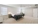 Spacious bedroom with neutral tones, a ceiling fan, and multiple windows for natural light at 2056 Airedale Way, Lake Alfred, FL 33850