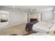 Bedroom featuring a ceiling fan, carpeted flooring, and ample space for furniture and decor at 2056 Airedale Way, Lake Alfred, FL 33850