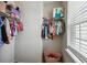 Well-organized closet with ample hanging space and shelving for optimal storage solutions at 2056 Airedale Way, Lake Alfred, FL 33850
