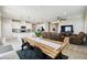 Open-concept living space featuring a kitchen, dining area, and living room for modern living at 2056 Airedale Way, Lake Alfred, FL 33850