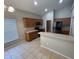 Well-lit kitchen with tile flooring, wood cabinets, and stainless steel appliances at 2131 Kaylas Ct, Orlando, FL 32817