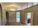 Spacious living room featuring neutral colors and arched doorways, offering a versatile living space at 2131 Kaylas Ct, Orlando, FL 32817