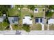 Aerial view of property with a white roof, surrounded by well-maintained lawns and greenery at 226 Palmyra Dr, Orlando, FL 32807