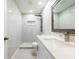 Bright bathroom features walk-in shower with modern fixtures, and a vanity with granite countertop at 226 Palmyra Dr, Orlando, FL 32807