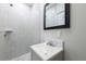Bathroom features a vanity with a gray cabinet and a shower with gray and white tile at 226 Palmyra Dr, Orlando, FL 32807