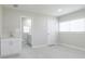 Bedroom boasts light gray walls, white cabinets, and windows offering natural light at 226 Palmyra Dr, Orlando, FL 32807
