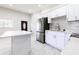 This spacious kitchen features stainless steel appliances, an island and tile floors at 226 Palmyra Dr, Orlando, FL 32807