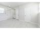 Bright living room offers tile floors, access to the utility room, and two exterior doors at 226 Palmyra Dr, Orlando, FL 32807