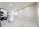 Bright open space with tile floors, a white kitchen, and multiple doors at 226 Palmyra Dr, Orlando, FL 32807