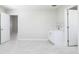 Empty room with tile floor, white walls, doors and a small sink and cabinet at 226 Palmyra Dr, Orlando, FL 32807